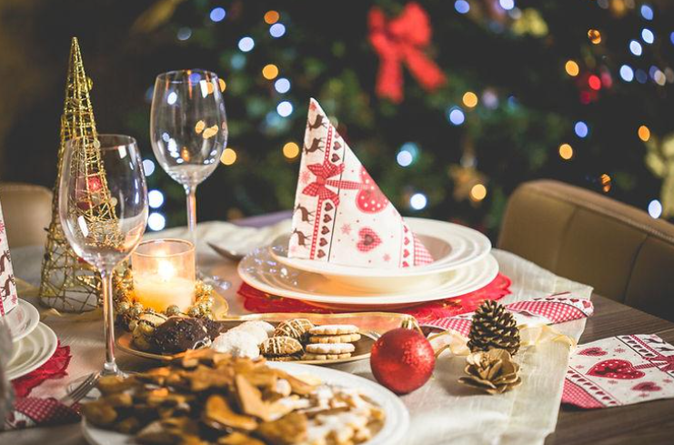 Christmas dinner table with candles and napkins